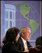 President George W. Bush makes remarks Monday, July 9, 2007, during A Conversation on the Americas at the Hyatt Regency Crystal City in Arlington, Va. The purpose of the gathering was to highlight extensive society-to-society relationships between the U.S. and its neighbors and to further promote the theme of how the United States helps its neighbors promote education, health care and economic opportunity at all levels. White House photo by Chris Greenberg