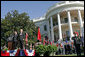 President George W. Bush and Chinese President Hu Jintao stand for the playing of the two countries' national anthems during the beginning of the South Lawn Arrival Ceremony Thursday, April 20, 2006.  White House photo by Shealah Craighead