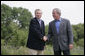 President George W. Bush shakes hands with NATO Secretary General Jaap de Hoop Scheffer Monday, May 21, 2007, as the two wound up a visit to the Bush Ranch in Crawford, Texas. The President thanked the Secretary-General for his leadership and called him a "strong advocate of fighting terror, spreading freedom, helping the oppressed and modernizing this important alliance." White House photo by Shealah Craighead