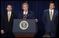 President George W. Bush discusses his smallpox vaccination program during a press conference as Secretary of Health & Human Services Tommy Thompson, left, and Director of the Office of Homeland Security Tom Ridge in the Dwight D. Eisenhower Executive Office Building Friday, Dec. 13.   White House photo by Paul Morse