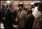 After signing into law the African Growth and Opportunity Act (AGOA) Acceleration Act of 2004, President George W. Bush meets with ceremony attendees in the Dwight D. Eisenhower Executive Office Building Tuesday, July 13, 2004.  White House photo by Paul Morse