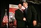 President George W. Bush greets Marc Morial, President of the National Urban League, after delivering his remarks in Detroit, Mich., Friday, July 23, 2004.  White House photo by Eric Draper