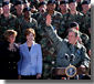 Surrounded by cheering soldiers at Fort Campbell, Kentucky, <a href="http://www.whitehouse.gov/news/releases/2001/11/20011121-3.html">President George W. Bush</a> addresses the troops and shares a turkey dinner with them Nov. 21. "More than 3,000 soldiers from this post have been deployed to Kosovo for six-month rotations," said the President. "They kept supplies away from rebels in Macedonia, made the recent election in Kosovo possible. I'm glad to report that all of them from this base will be home by Thanksgiving.". White House photo by Tina Hager.