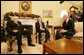 President George W. Bush shares a moment with Ian Paisley, left, First Minister of Northern Ireland, and Martin McGuinness, Deputy First Minister of Northern Ireland, during their visit Friday, Dec. 7, 2007, to the Oval Office. White House photo by Chris Greenberg