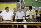 President George W. Bush, joined by California Governor Arnold Schwarzenegger, second from right, is briefed by U.S. Forest Service Regional Forester Randy Moore, right, Thursday, July 17, 2008 in Redding, Calif., during President Bush's tour to survey the wildfire damage in Northern California. White House photo by Eric Draper