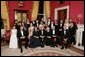 President George W. Bush, Laura Bush, former First Lady Barbara Bush, and former President George H.W. Bush sit surrounded by family in the Red Room, Thursday, Jan. 6, 2005. Friends and family joined former President Bush and Mrs. Bush in celebrating their 60th wedding anniversary during a dinner held at the White House. Also pictured are, from left, Georgia Grace Koch, Margaret Bush, Walker Bush, Marvin Bush, Jenna Bush, Doro Koch, Barbara Bush, Robert P. Koch, Pierce M. Bush, Maria Bush, Neil Bush, Ashley Bush, Sam LeBlond, Robert Koch, Nancy Ellis LeBlond, John Ellis Bush, Jr., Florida Gov. John Ellis "Jeb" Bush, Mandi Bush, George P. Bush, and Columba Bush.  White House photo by Eric Draper