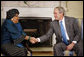 President George W. Bush shakes hands with Liberia President Ellen Johnson Sirleaf following their meeting Wednesday, Oct. 22, 2008, in the Oval Office at the White House. President Bush said to President Sirleaf, "I have come to respect you and admire you because of your courage, your vision, your commitment to universal values and principles." White House photo by Eric Draper