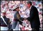 President Bush presents a diploma to a United States Military Academy graduate at West Point, N.Y. Saturday, June 1.  