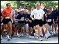 President George W. Bush competes in the 3 mile run as part of The President's Fitness Challenge at Ft. McNair on Saturday June 21, 2002.  