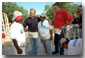 President Bush and Secretary for Housing and Urban Development Martinez, far right, talk with new friends during a break from their house-building efforts at the Waco, Texas, location of Habitat for Humanity's "World Leaders Build" construction drive August 8, 2001. White House photo by Eric Draper.