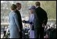 Arriving for the official ceremonial welcome for America's State Visit, President George W. Bush and Laura Bush are greeted by Her Majesty Queen Elizabeth and Prince Philip, Duke of Edinburgh, at Buckingham Palace in London Wednesday, Nov. 19, 2003.  White House photo by Eric Draper