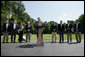 President George W. Bush gestures as he addresses his remarks to the media Friday, Aug. 18, 2006 in Camp David, Md., following a meeting with his economic advisors, from left to right, Edward P. Lazear chairman Council of Economic Advisors; Rob Portman, director of the Office of Management & Budget; U.S. Secretary of Labor, Elaine Chao; Vice President Dick Cheney; U.S. Secretary of the Treasury Henry M. Paulson; U.S. Sec. of Commerce Carlos Gutierrez; U.S. Secretary of Health & Human Services Michael O. Leavitt and Allan Hubbard, director of the National Economic Council.  White House photo by David Bohrer