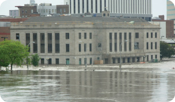 The Cedar River poured over its banks last month, flooding much of downtown Cedar Rapids, Iowa, including the basement and first floor of the courthouse for the U.S. District Court for the Northern District of Iowa.  The nearby bankruptcy court also was forced to evacuate its building due to flood waters.  