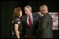  President George W. Bush greets Galveston County Employees Bea Bentley and her husband Christopher at the end of a roundtable discussion on Strengthening Social Security at the University of Texas Medical Branch in Galveston, Texas, Tuesday, April 26, 2005.  White House photo by Eric Draper