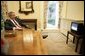 President George W. Bush watches the launch of the Space Shuttle Discovery in the Oval Office’s Private Dining Room Tuesday, July 26, 2005.  White House photo by Eric Draper