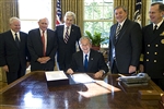 AUTHORIZATION ACT SIGNING - Click for high resolution Photo