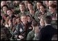 President George W. Bush is greeted with a thunderous cheer as he talks with troops during his visit to Elgin Air Force Base in Florida February 4. White House photo by Paul Morse.