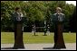 Presidents Pervez Musharraf of Pakistan and George W. Bush hold a joint press conference at Camp David Tuesday, June 24, 2003. "Greater economic development is also critical to fulfilling the hopes of the Pakistani people," said President Bush. "Since we met last year, the United States has cancelled $1 billion of debt Pakistan owed our country. And today I'm pleased to announce that our nations are signing a trade and investment framework agreement, which creates a formal structure for expanding our economic partnership."  White House photo by David Bohrer