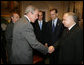 President George W. Bush drops by a meeting between Vice President Dick Cheney and Prime Minister Jaroslaw Kaczynski of Poland Wednesday, Sept. 13, 2006, in the Roosevelt Room of the White House.  White House photo by David Bohrer