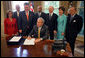 President George W. Bush signs into law H.R. 1, Implementing Recommendations of the 9/11 Commission Act of 2007, Friday, August 3, 2007, in the Oval Office.  White House photo by Eric Draper