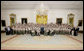 President George W. Bush poses for a photo Thursday, July 31, 2008 in the East Room of the White House, with members of the Boy Scouts and the families of Boy Scout victims of the tornado that struck the Little Sioux Scout Ranch in Little Sioux, Iowa on June 11, 2008.  White House photo by Chris Greenberg