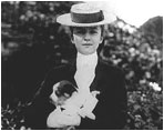 Theodore Roosevelt's oldest child, Alice, holds her dog on the White House lawn, June 17, 1902. Alice also owned a snake, which died a suspicious death at the hands of one of her siblings.