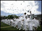 U.S. Coast Guard Academy graduates toss their hats into the air in celebration, Wednesday, May 21, 2008 during commencement ceremonies in New London, Conn. White House photo by David Bohrer