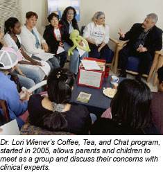A photo of parents and children who attended a session of Dr. Lori Wiener's Coffee, Tea, and Chat program, where they can gather with clinical experts to discuss their concerns.