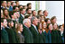 President George W. Bush and Vice President Dick Cheney pose with the Fall 2004 White House Interns on the North Portico steps of the White House, Nov. 15, 2004.