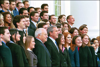 President George W. Bush and Vice President Dick Cheney pose with the Fall 2004 White House Interns on the North Portico steps of the White House, Nov. 15, 2004.