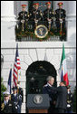 President George W. Bush is embrace by Prime Minister Silvio Berlusconi folllowing President Bush's remarks Monday, Oct. 13, 2008 , welcoming Prime Minister Berlusconi to the White House. White House photo by Chris Greenberg