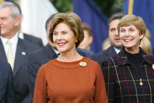 Mrs. Laura Bush and Mrs. Deborah Mullen, wife of the Chairman of the Joint Chiefs of Staff, Admiral Mike Mullen, watch the White House South Lawn ceremonies Oct. 13, 2008, for the State Arrival of Italian Prime Minister Silvio Berlusconi. White House photo by Joyce N. Boghosian