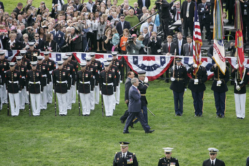 President George W. Bush and Italian Prime Minister Silvio Berlusconi review the troops during welcoming festivities Monday, Oct. 13, 2008, on the South Lawn of the White House. White House photo by Grant Miller