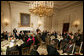 President George W. Bush welcomes guests to the Iftaar Dinner with Ambassadors and Muslim leaders in the State Dining Room of the White House, Thursday, Sept. 17, 2008, to celebrate the traditions of Islamic faith and culture. White House photo by Chris Greenberg