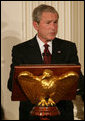 President George W. Bush welcomes guests to the Iftaar Dinner with Ambassadors and Muslim leaders in the State Dining Room of the White House, Thursday, Sept. 17, 2008, to celebrate the traditions of Islamic faith and culture. White House photo by Chris Greenberg