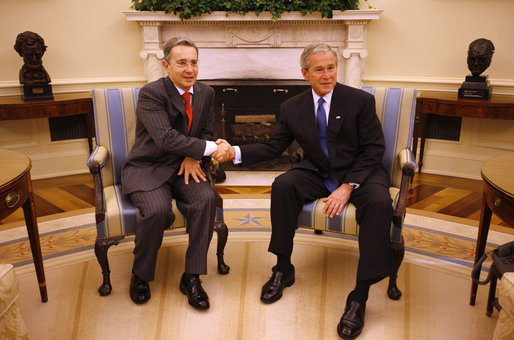 President George W. Bush shakes hands with Colombian President Alvaro Uribe following a meeting Saturday, Sept. 20, 2008, in the Oval Office of the White House. White House photo by Eric Draper