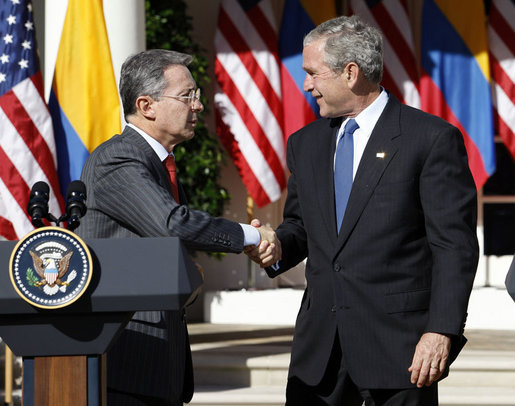 President George W. Bush shakes hands with Colombian President Alvaro Uribe following a joint press availability Saturday, Sept. 20, 2008, in the Rose Garden at the White House. White House photo by Eric Draper
