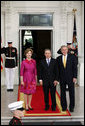 President George W. Bush and Mrs. Laura Bush greet Colombian President Alvaro Uribe on the North Portico Saturday, Sept. 20, 2008, for a social dinner at the White House. White House photo by Joyce N. Boghosian