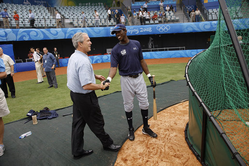 President George W. Bush meets with U.S. Olympic men's baseball team player Dexter Fowler of Alpharetta, Ga., while attending a practice game between the U.S. and the Chinese Olympic men's baseball teams Monday, Aug. 11, 2008, at the 2008 Summer Olympic Games in Beijing. White House photo by Eric Draper