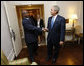 President George W. Bush greets Uganda's President Yoweri Museveni Tuesday, Sept. 23, 2008, at The Waldorf-Astoria Hotel in New York. President Bush thanked his counterpart for implementing the Malaria Initiative and said, "There's been over 200,000 bed nets distributed in your country, Mr. President, and that's because of the leadership of you and the organization of your government." White House photo by Eric Draper