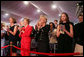 Mrs. Laura Bush stands with Mrs. Sarah Randt, spouse of U.S. Ambassador to China Sandy Randt, left, Mrs. Anne Johnson, Director of Art in Embassies Program, and Ms. Barbara Bush during applause for President George W. Bush Friday, Aug. 8, 2008, at the dedication ceremony for the U.S. Embassy in Beijing. White House photo by Shealah Craighead