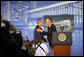 Former President George H.W. Bush embraces President George W. Bush after introducing his son during dedication ceremonies Friday, Aug. 8, 2008, at the U.S. Embassy in Beijing. White House photo by Shealah Craighead