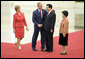 President George W. Bush and Mrs. Laura Bush are greeted by Chinese President Hu Jintao and Madam Liu Yongqing at the Great Hall of the People in Beijing Friday, Aug. 8, 2008, for the social lunch in honor of the 2008 Summer Olympic Games. White House photo by Eric Draper