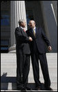 President George W. Bush shakes hands with Secretary Hank Paulson of the U.S. Department of Treasury after visiting the department Friday, Oct. 3, 2008. Said the President upon his departure, "Mr. Secretary, you and your team have worked incredibly hard. You've worked with the Congress; you've worked with the financial markets, both domestically and internationally. I know that your people are exhausted in there, and I really appreciate the fact that I'll be signing a piece of legislation that will be a part of solving this crisis, an important part of solving the crisis." White House photo by Eric Draper