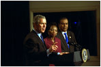 President George W. Bush discusses Global and Domestic HIV and AIDS during a meeting in the Dwight D. Eisenhowser Executive Office Building Jan. 31, 2003. Pictured with the President are Ambassodor Edith Ssempala of Uganda, center, and Ambassador Odeen Ishmael of Guyana.