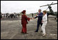 President George W. Bush and Mrs. Laura Bush are greeted by President Ellen Johnson Sirleaf of Liberia Thursday, Feb. 21, 2008, upon their arrival to the Spriggs Payne Airfield in Monrovia, Liberia. White House photo by Eric Draper