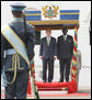 President George W. Bush stands with Ghana President John Agyekum Kufuor during the official welcome to Osu Castle, Wednesday, Feb. 20, 2008 in Accra, Ghana. White House photo by Eric Draper