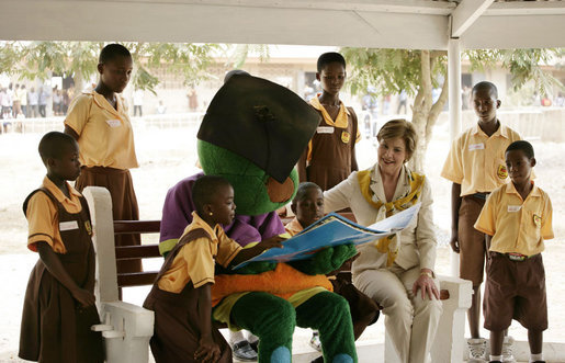 Mrs. Laura Bush participates in a reading lesson with students in their "reading hut" with the school's reading mascot Wednesday, Feb. 20, 2008, at the Mallam D/A Primary School in Accra, Ghana. White House photo by Shealah Craighead