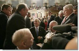 President George W. Bush is surrounded by members of Congress as he prepares to leave the House chamber Monday evening, Jan. 28, 2008 at the U.S. Capitol, following the President's State of the Union Address. White House photo by Eric Draper