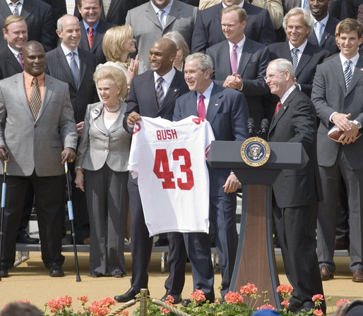 President George W. Bush holds a New York Giants jersey, presented to him by Giants wide receiver Amani Toomer Wednesday, April 30, 2008, as part of an event honoring the Super Bowl XLII Champions on the South Lawn of the White House. White House photo by Shealah Craighead